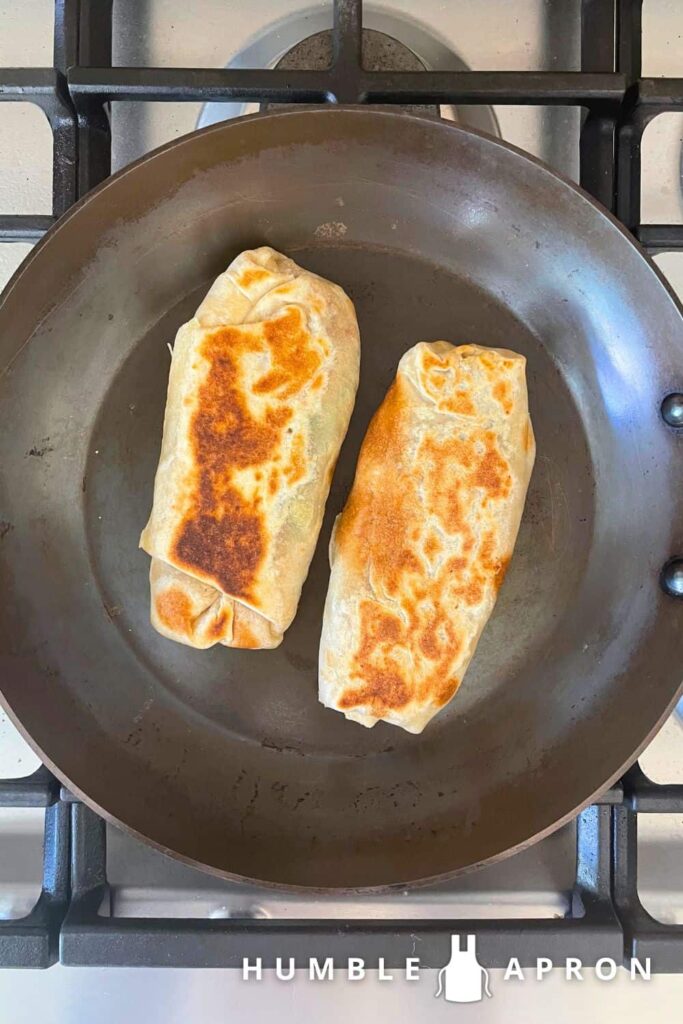 Vegetable Loaded Breakfast burritos on a skillet